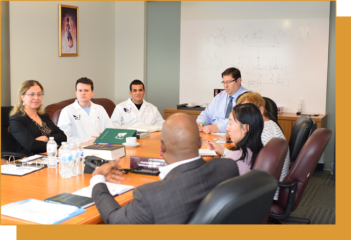 Faculty of TIPT sitting around the boardroom desk